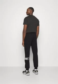 Mizuno ATHLETICS PANT - Jogginghose - Black -Mizuno 0246d5cac15b4cb1bd2717cac768945c